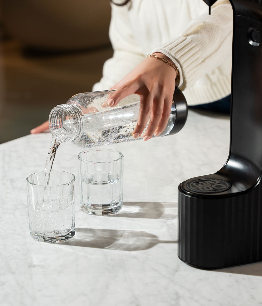 Qarbo black beverage carbonator on kitchen counter
