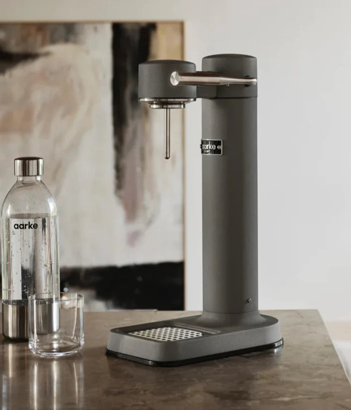 Aarke Carbonator 3 Matte Grey with sparkling water glass