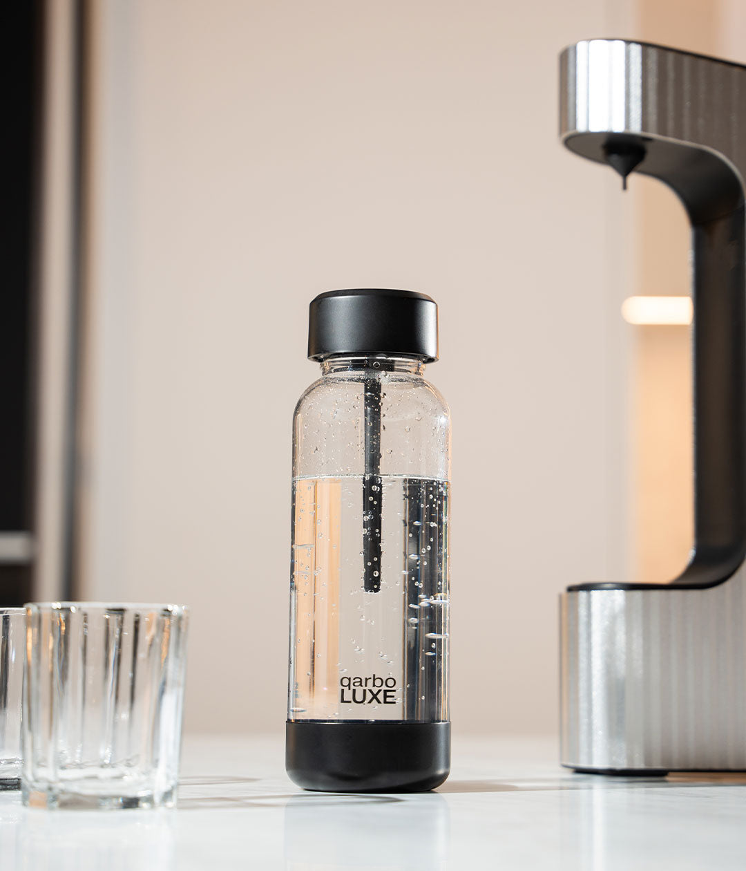Qarbo silver beverage carbonator on kitchen counter